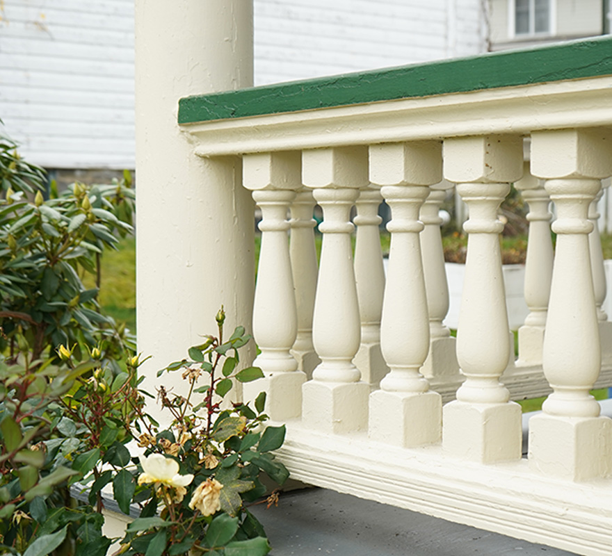 House railing painted white and green